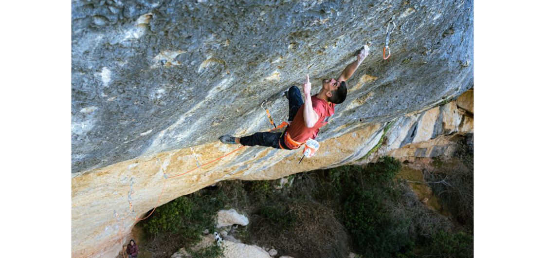 Climbed users one-finger pocket on steep rock climb. It looks very strenuous.