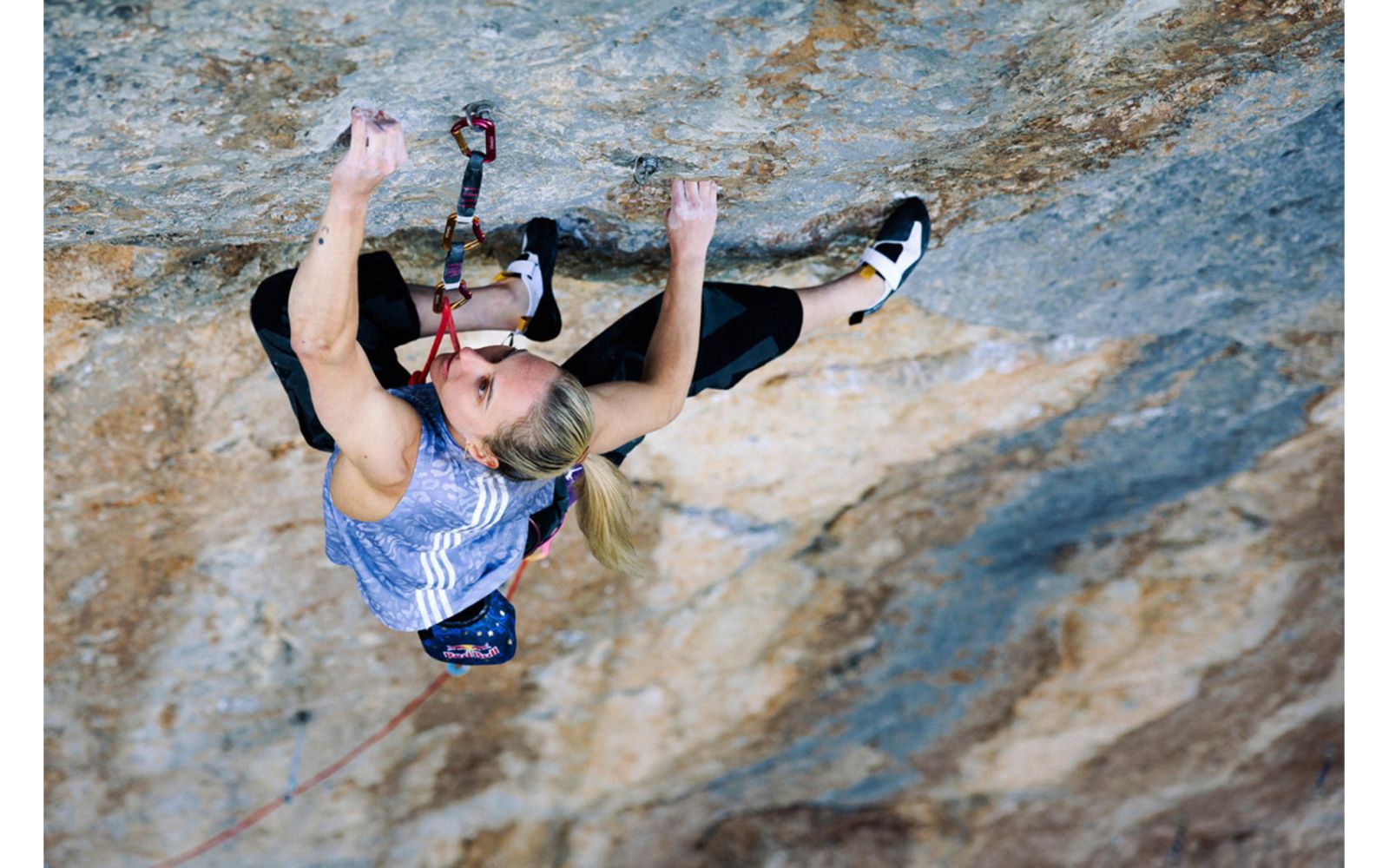 Femalew rock climber on terrifically hard route