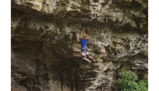 Climber on steep roof