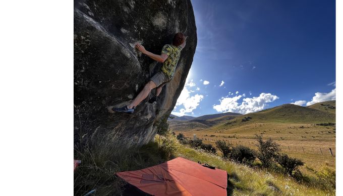 Boulderer on limestone boulder
