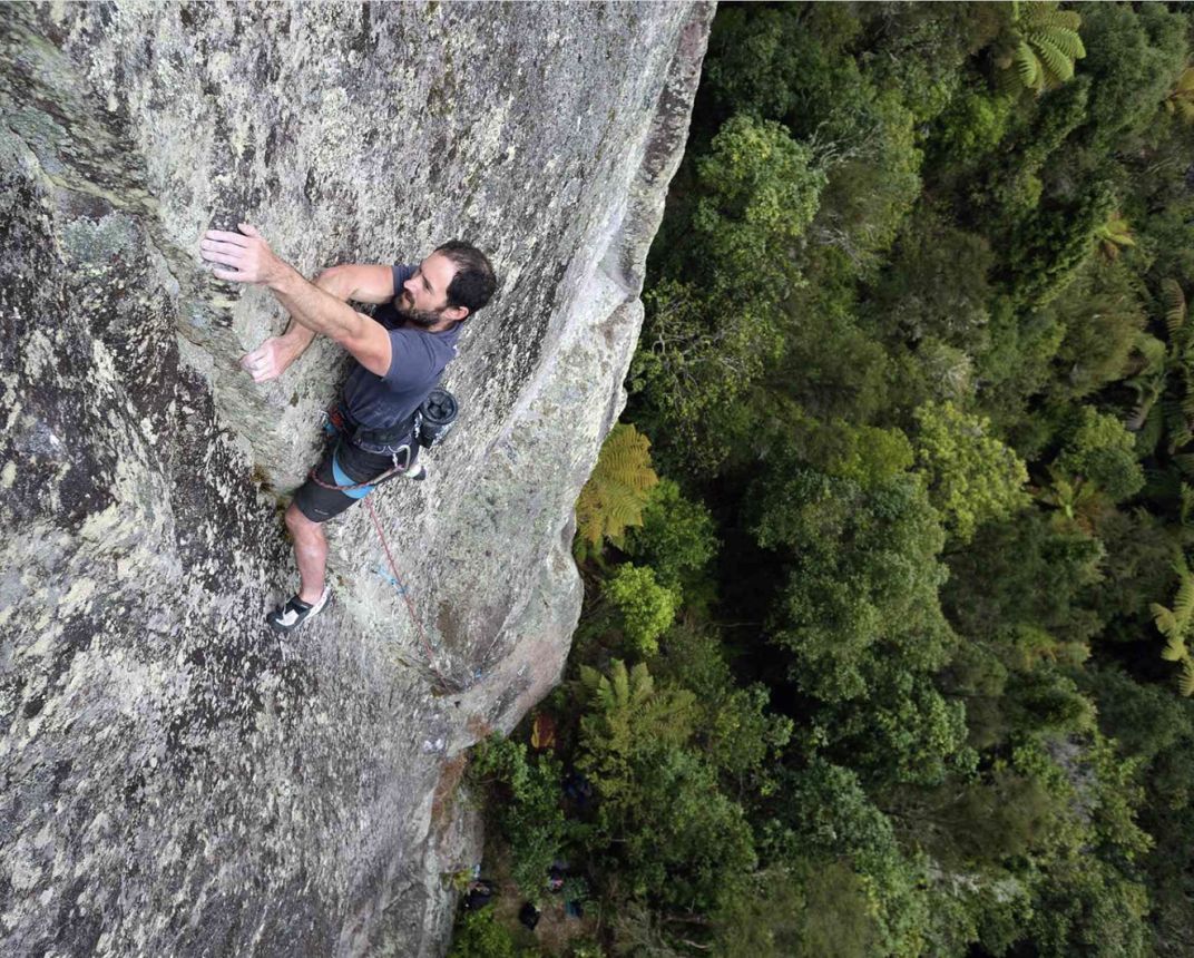 Climber on lichenous ignimbrite