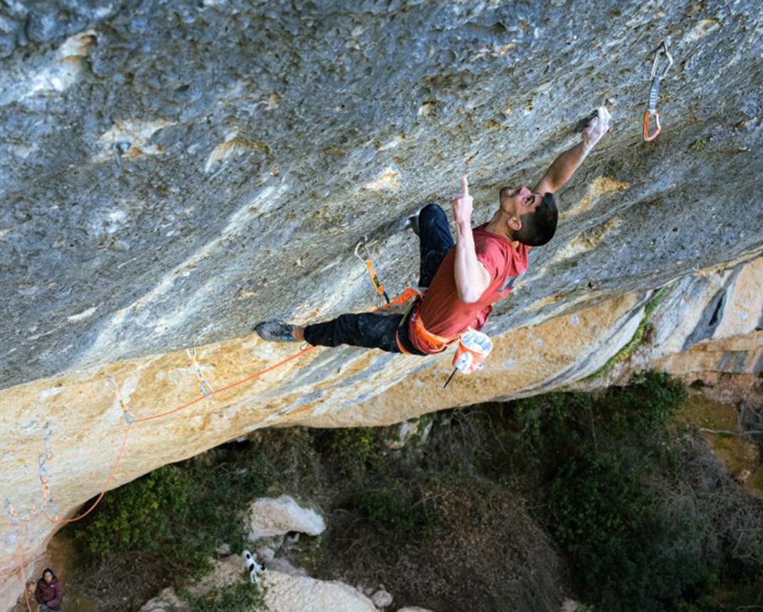 Climbed users one-finger pocket on steep rock climb. It looks very strenuous.