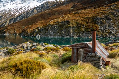 alpine hut beside lake