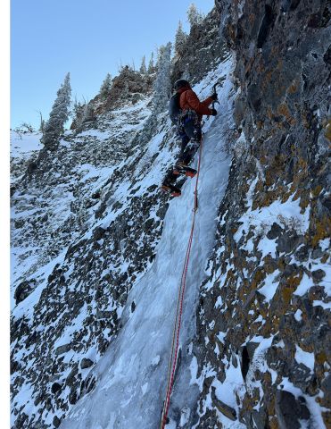 Ice climber with sling on harness