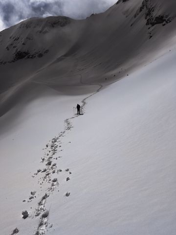 Climber's footsteps on snowfield