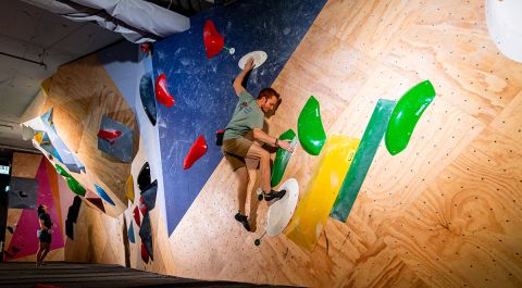 Climber on slab boulder