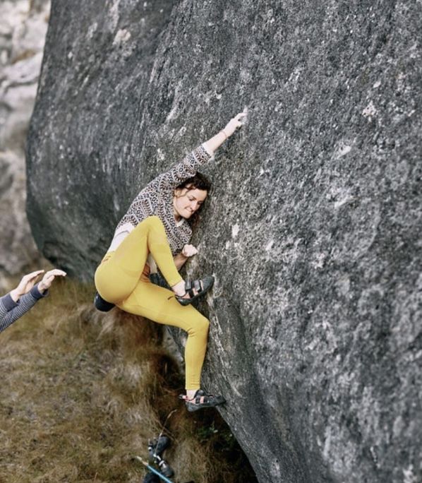 boulderer on limestone boulder