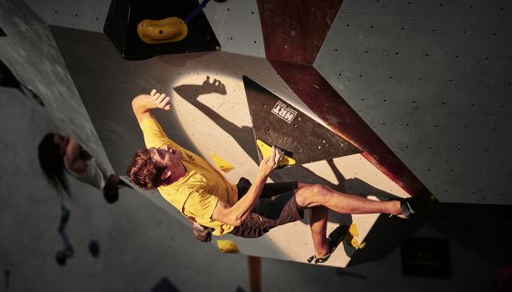 Competition climber on roof bloc