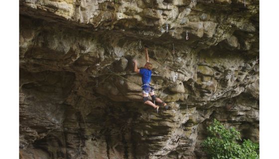 Climber on steep roof
