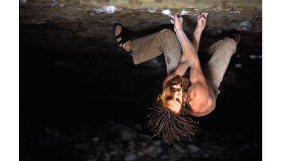 Climber expresses himself on steep rocks